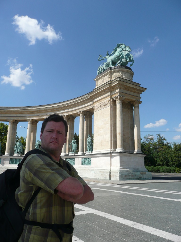 Al in front of hungary national monument,  a triumphant memorial to all the surrounding people they've slaughtered